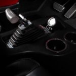 Hurst V-Matic2 T-handle shifter controlling the C6 Select-Shift automatic transmission in the 1967 Ford Mustang Fastback 501 Pro-Touring, installed in the custom center console