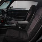 Full interior overview of the black 1978 Pontiac Trans Am WS6 showing the completely rebuilt black interior with new wiring harnesses, fresh trim, moldings, and upholstery throughout