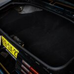 Trunk interior of the black 1978 Pontiac Trans Am WS6 showing the clean restored finish, part of the complete restoration covering the body, engine bay, interior, and trunk