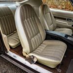 Passenger's seat of the 1972 Chevrolet Camaro RS/SS in original brown Z87 Custom Interior upholstery with AK1 custom seat belts, showing survivor-grade condition